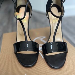 Black strappy Louboutins